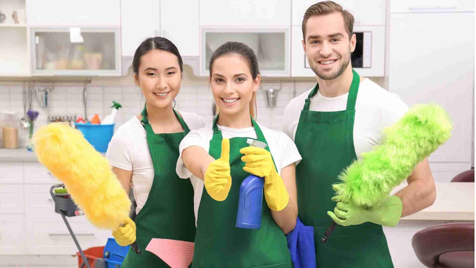 3 cleaners holding cleaning tools